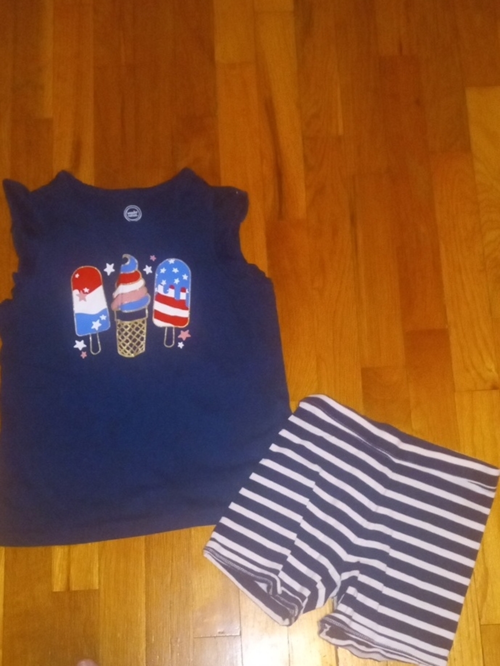 girl med 7/8 blue white striped shorts and graphic print tee